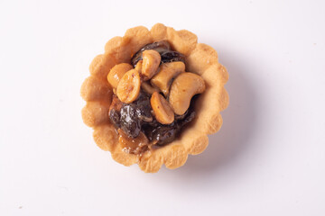 Cookies, nuts and raisins on a white background