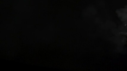 45 muzzle flashes continue fire montage in slow-motion. Dangerous shooting against black screen muzzle flashes in slow-motion.