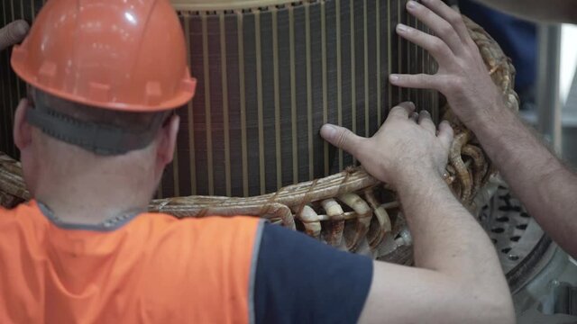 Install the rotor in the stator of the electric motor
