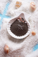 Detox and beauty concept.  Dry clay around salt and marine shells.