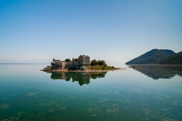 Montenegro landscape. In the center of Skadar Lake are the ruins of a fortress - Grmozur Prison....