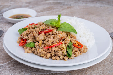 rice topped with stir-fried mince pork and basil , Thai famous Street food