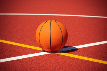 Basketball on the center of outdoor court