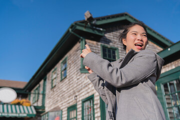 safety travel asian female traveller  new normal lifestyle hand use smartphone capture sight seeing moment on wooden bridge at old town Newport rhode island