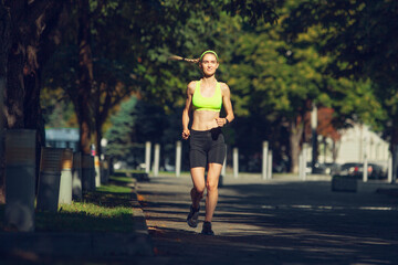 Motivation. Female runner, athlete training outdoors. Professional runner, jogger working out on...