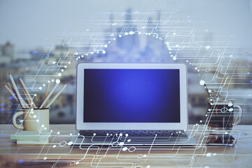 Double exposure of laptop computer and technology theme hologram. Concept of freelance work.