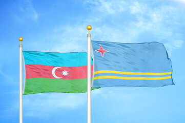 Azerbaijan and Aruba two flags on flagpoles and blue sky