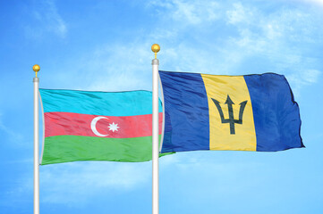 Azerbaijan and Barbados two flags on flagpoles and blue sky