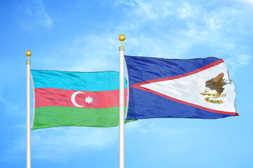 Azerbaijan and American Samoa two flags on flagpoles and blue sky