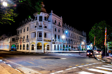 Fototapeta na wymiar night view in Kandy city, Sri Lanka, this is an old building called queens hotel situated near the temple of the Tooth (Dalada Maligawa)