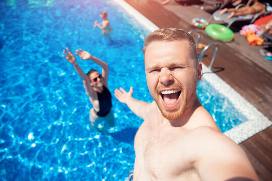 Selfie photo loving Caucasian couple friends on vacation on background of pool summer travel