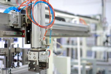Automation concept: View of gripper unit in automatic machine.