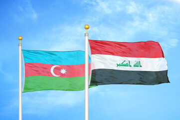 Azerbaijan and Iraq two flags on flagpoles and blue sky