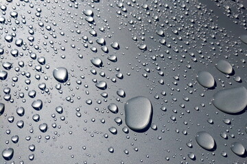 some raindrops on a surface as background