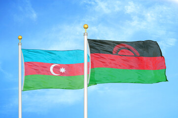 Azerbaijan and Malawi two flags on flagpoles and blue sky