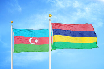 Azerbaijan and Mauritius two flags on flagpoles and blue sky