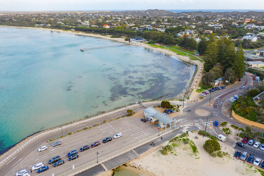 Aerial view of a roundabout with cars lining up at a ferry terminal