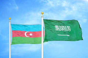 Azerbaijan and Saudi Arabia two flags on flagpoles and blue sky