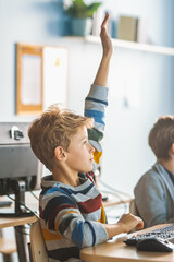 School Science Classroom: Boy Raises Hand with Question. Teacher Educates Smart Little...