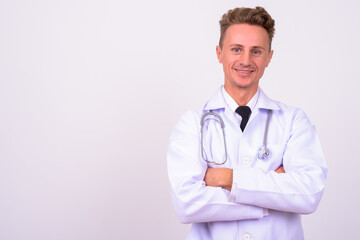 Fototapeta premium Portrait of happy handsome man doctor with blond curly hair