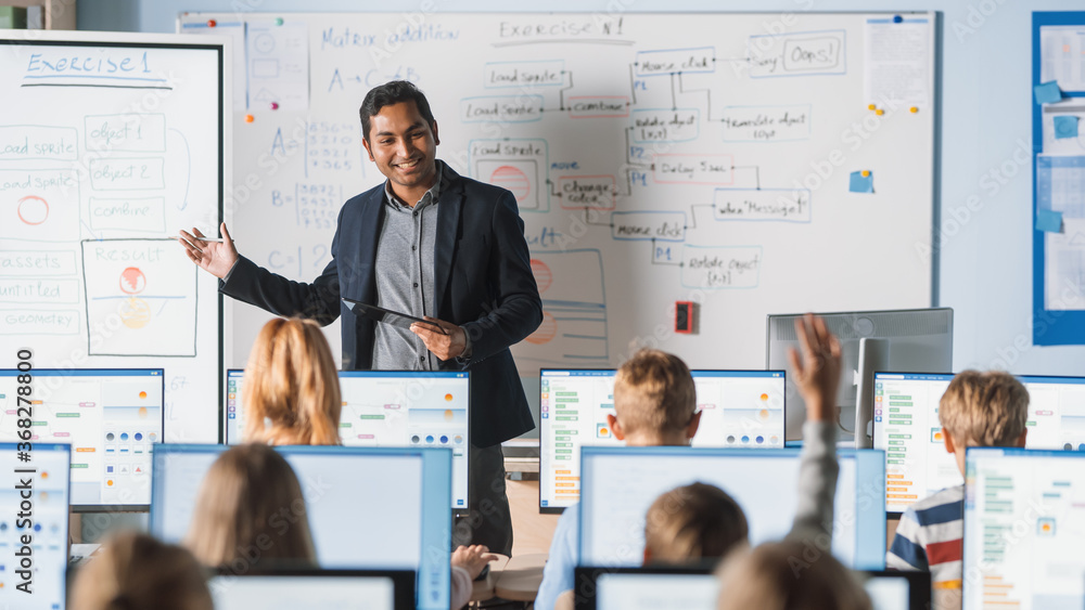 Poster elementary school class: teacher uses interactive digital whiteboard, explains lesson to diverse gro