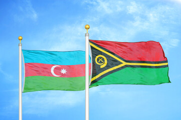 Azerbaijan and Vanuatu two flags on flagpoles and blue sky