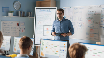 Elementary School Class: Teacher Uses Interactive Digital Whiteboard, Explains Lesson to Diverse Group of Smart Children. Kids getting Modern Education, Learn Computer Science, Software Programming