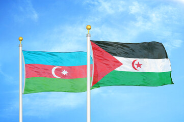 Azerbaijan and Western Sahara two flags on flagpoles and blue sky