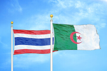 Thailand and Algeria two flags on flagpoles and blue sky