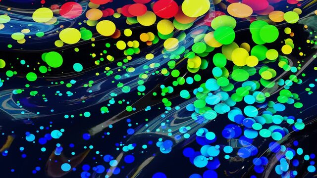 abstract looped background of shiny glossy surface like wavy transparent liquid with rainbow color circles float like drops of paint in oil. Beautiful creative background with color gradient in 4k.