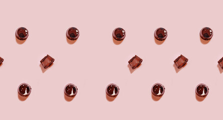 Chocolate praline with toffee filling on pink backgound