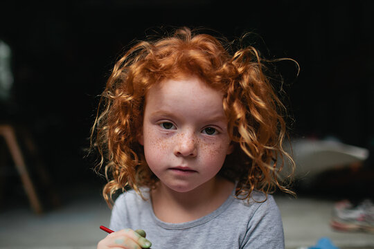 Portrait Of A Young Girl With A Serious Expression