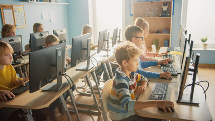 Elementary School Computer Science Classroom: Diverse Group of Little Smart Schoolchildren using Personal Computers, Learn Informatics, Internet Safety, Programming Language for Software Coding - obrazy, fototapety, plakaty