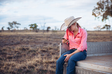 Female farmer holding iPhone