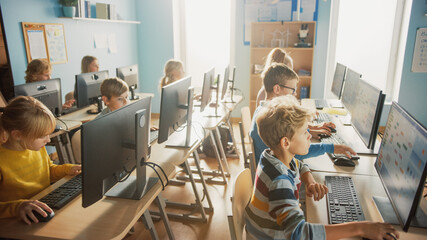 Elementary School Computer Science Classroom: Diverse Group of Little Smart Schoolchildren using...