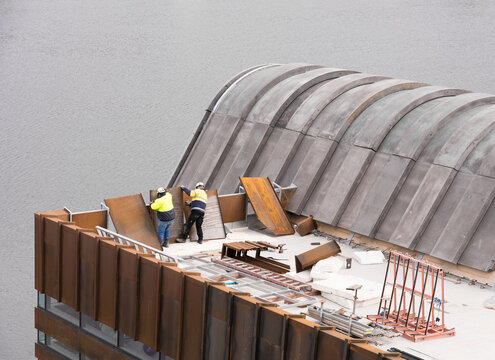 Construction of a building extension on the side of a river