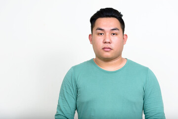 Fototapeta premium Portrait of young handsome overweight Asian man