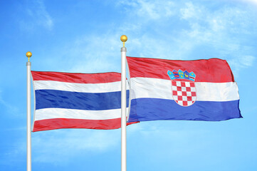 Thailand and Croatia two flags on flagpoles and blue sky