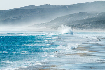 seahaze and waves crashing into shore