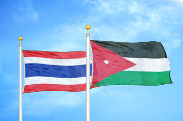 Thailand and Jordan two flags on flagpoles and blue sky