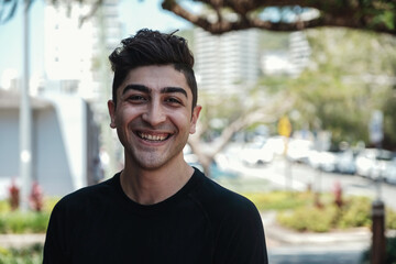 Happy multicultural young adult man, university student