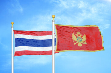 Thailand and Montenegro two flags on flagpoles and blue sky