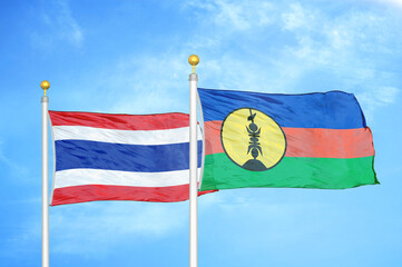 Thailand and New Caledonia two flags on flagpoles and blue sky