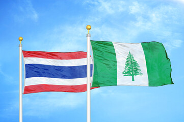 Thailand and Norfolk Island two flags on flagpoles and blue sky