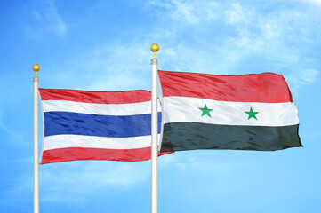 Thailand and Syria two flags on flagpoles and blue sky