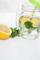 
Drink with lemon, mint and ice. All this on a white background