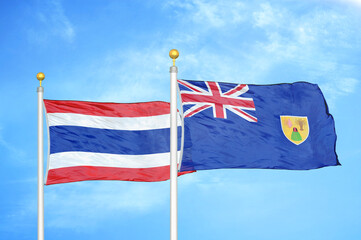 Fototapeta premium Thailand and Turks and Caicos Islands two flags on flagpoles and blue sky