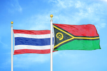 Thailand and Vanuatu two flags on flagpoles and blue sky