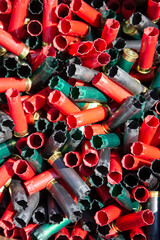 Empty shotgun shells from trap shooting, skeet, or sporting clays.