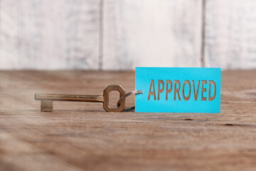 Writing note showing Approved. Business concept for to have or express a favorable opinion of, to accept as satisfactory Paper accessories with smartphone arranged on different background